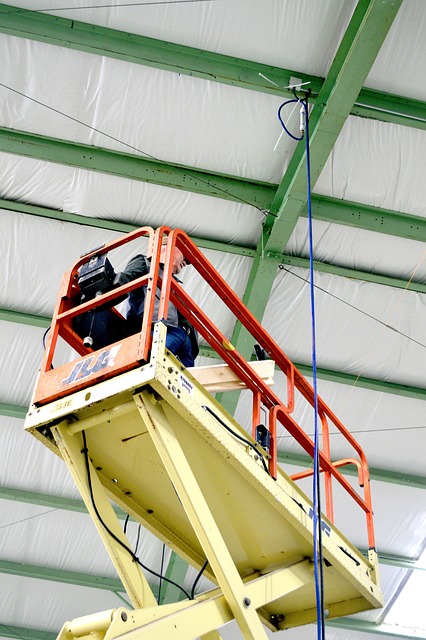 Scissor lift raised inside a warehouse